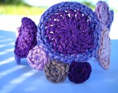 lavenders peach fiber art crochet bracelet by Even Howard. vegan jewelry, purple, plum, peach thread crochet
