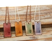 Sweet little personalized stamped initial enamel pendant necklace on basemetal chain.