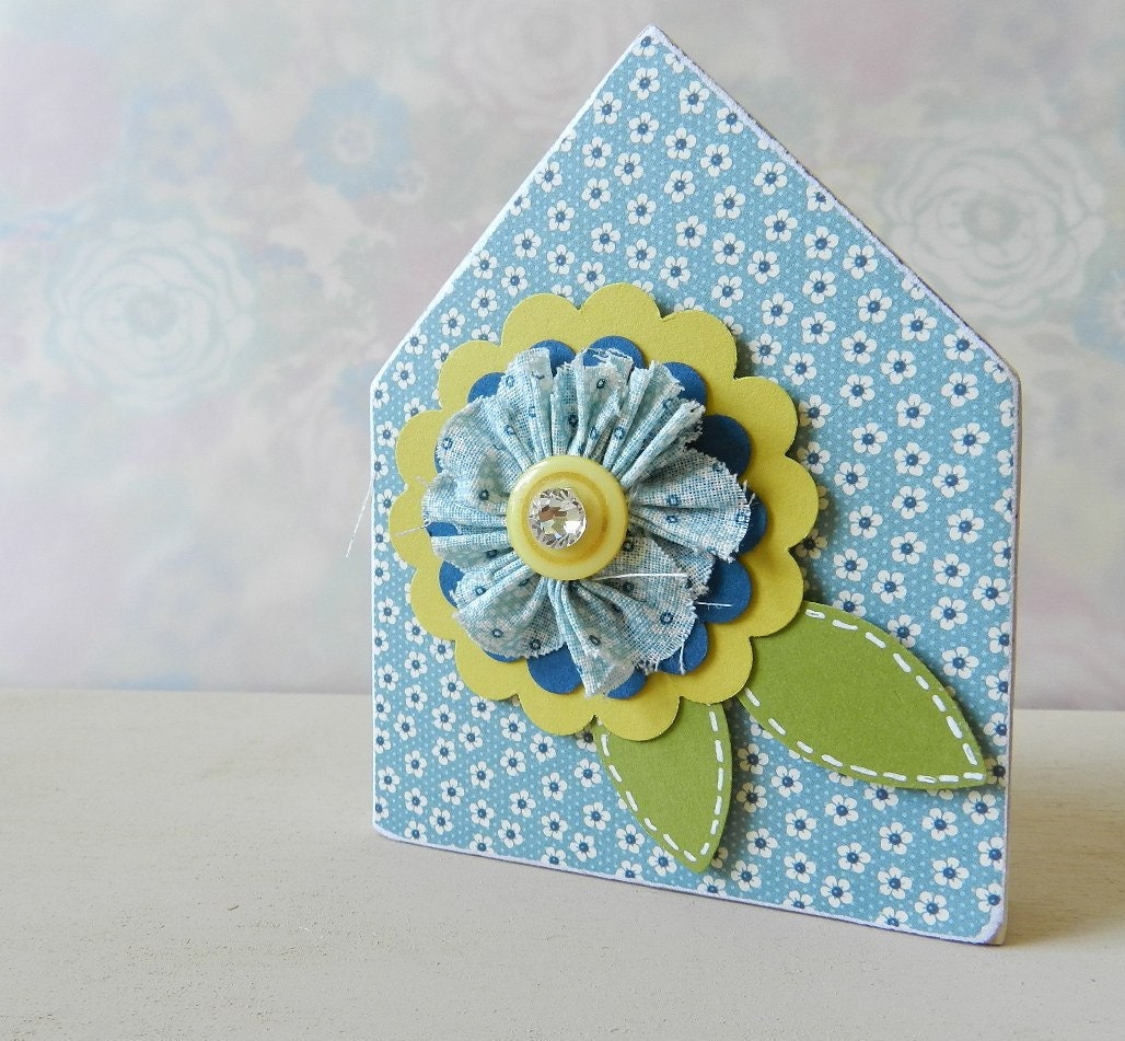 Mini wooden house with fabric and paper flower decor
