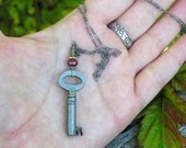 vintage skeleton key, ruby and vesuvianite gemstones and antiqued sterling silver necklace. OOAK. july birthstone.