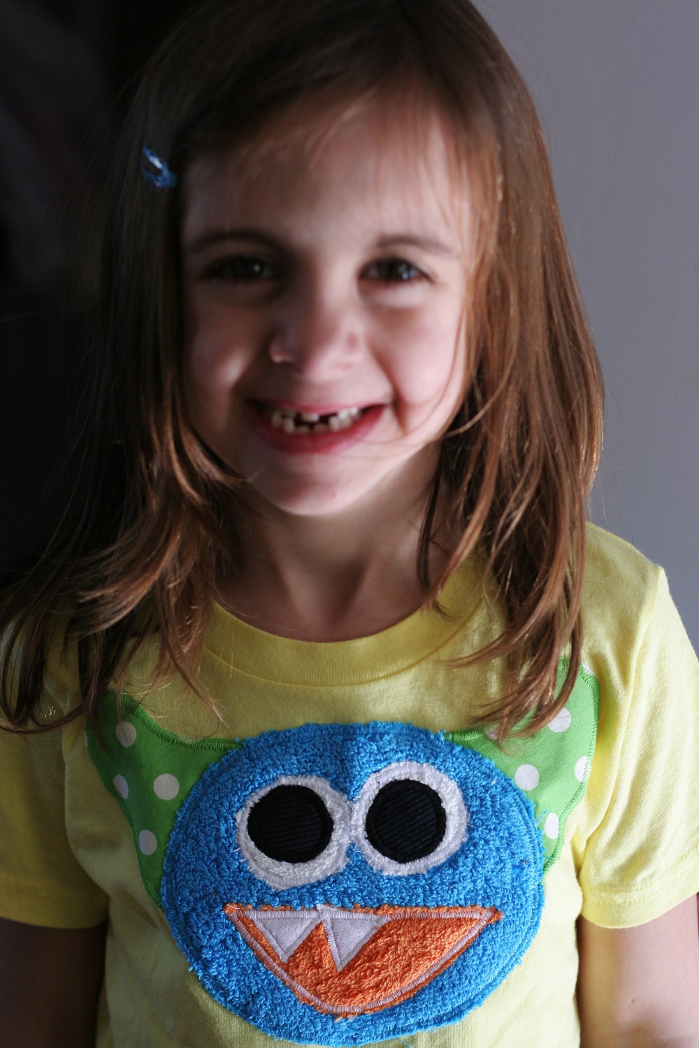 Cam the Monster Tee on a S/S lemon yellow sizes: 2,4,6,8,10,12