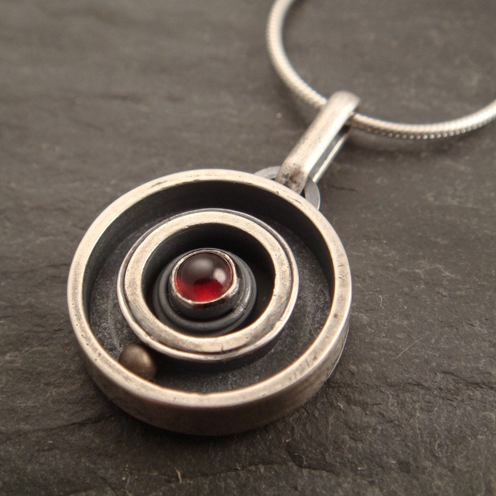 Round and Round Pendant with Garnet