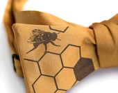 Oh Honey. Mustard yellow bow tie, self-tie. Silkscreened honeybees. Chocolate brown print.