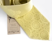 Cottage Lace, butter yellow silk necktie. Doily pattern screenprinted men's tie. Pale yellow tone on tone print.