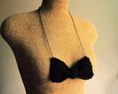 knit bow tie necklace, preppy style in black yarn on long brass chain crochet