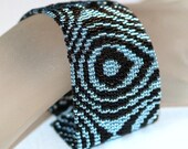 Aqua Raindrops ... Peyote Bracelet . Silver-Lined Beads . Pale Blue . Black . Beadweaving . Wide Cuff . Abstract Design . Concentric