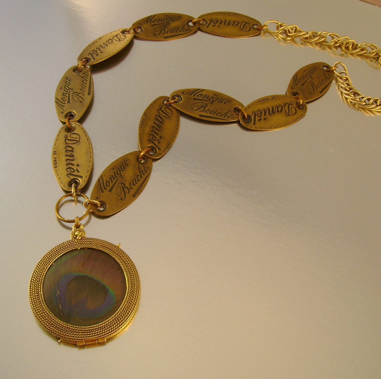 Tag, You're It - Vintage Daniel Monique Bouche Clothing Tag Peacock Feather Locket Mirror Necklace