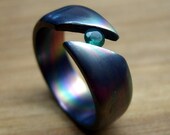 Titanium Wedding Ring- Diagonal Tension Set with Green Stone