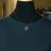 X. Pendant on a Chain.