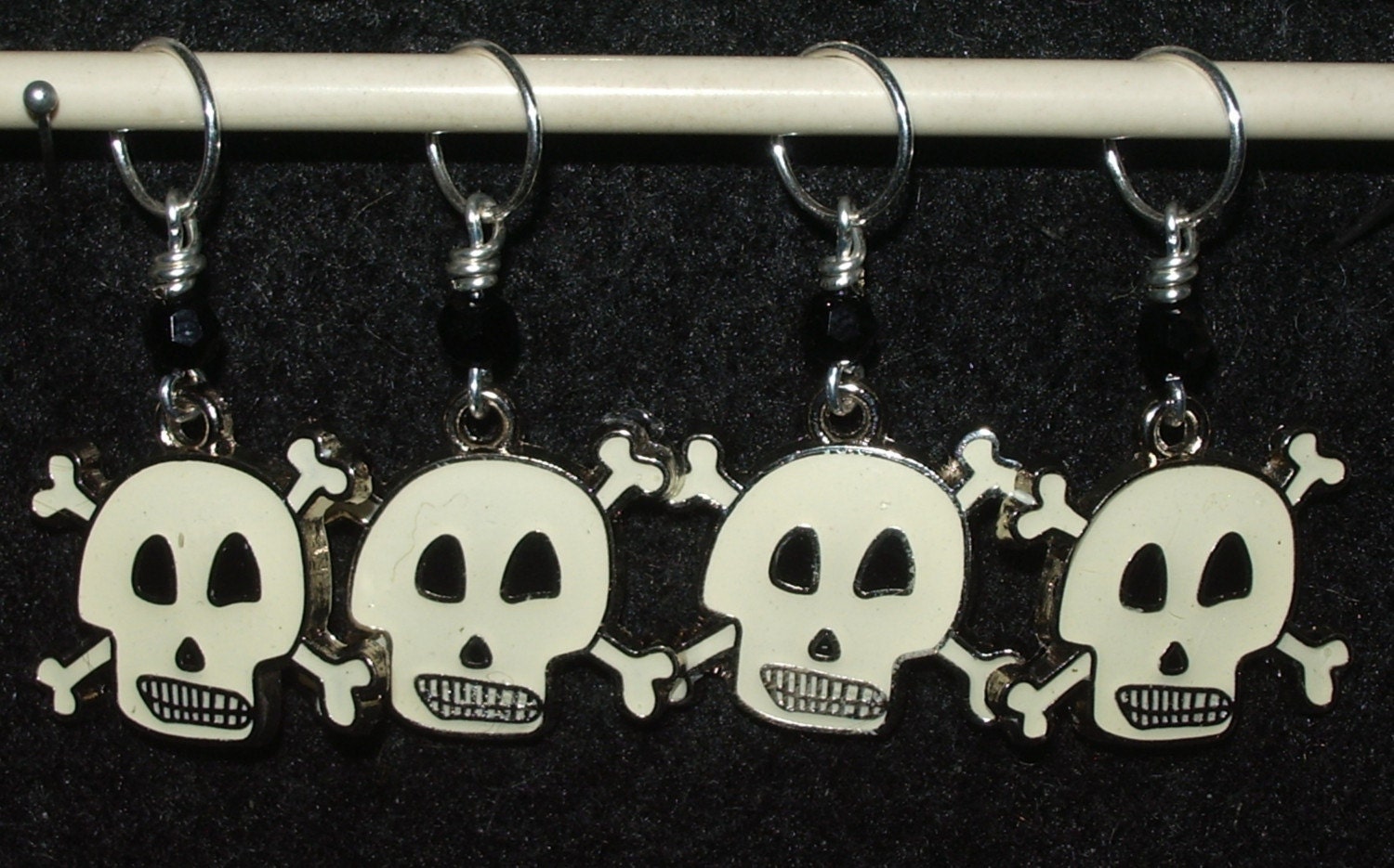 Fun black and creme skulls with black crystal - set of four