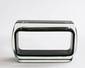 Black rectangle lucite bracelet with safety pins