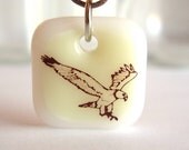 Wild Bird Pendant. Eagle Landing on Vanilla and White. A fused glass pendant necklace.