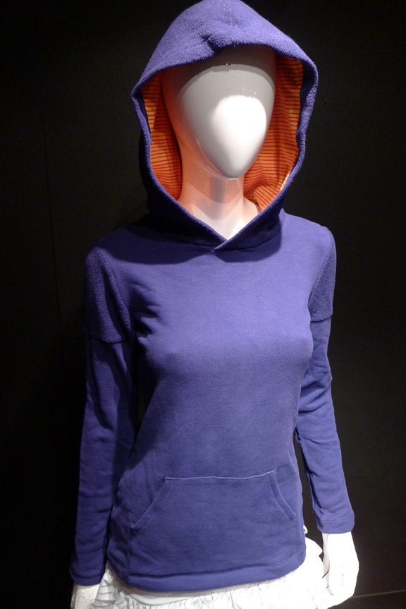 purple hoodie with orange and red striped lining