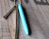silver, gold, and turquoise stick necklace.