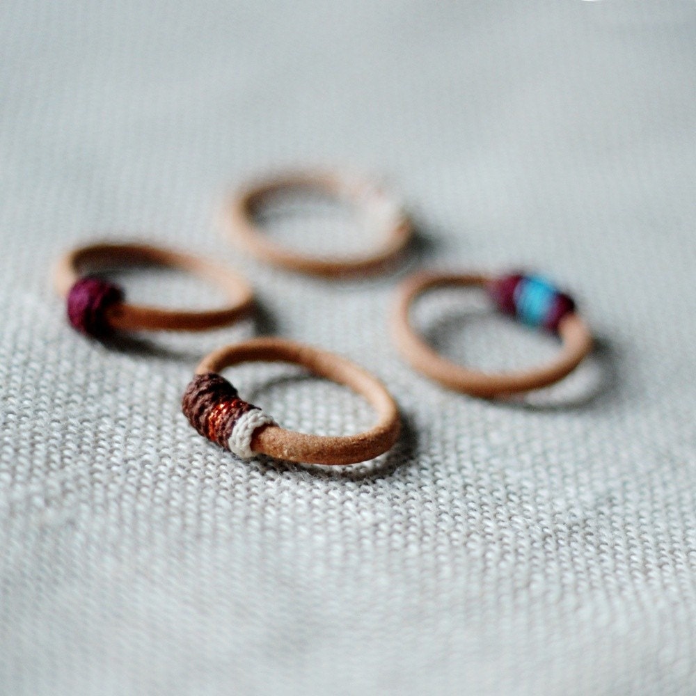 Set of four leather and cotton rings