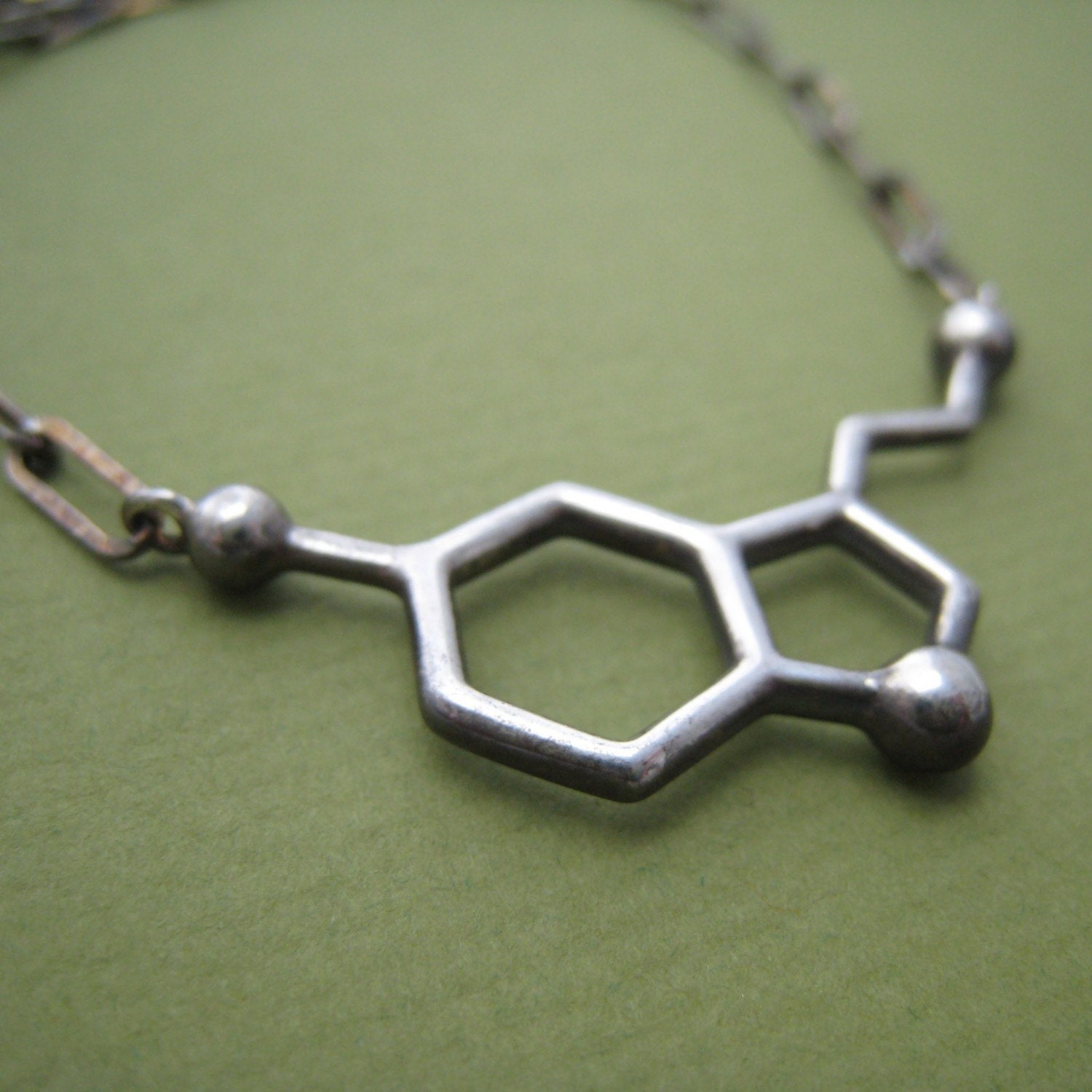serotonin molecule necklace, styled for men serotonin molecule necklace, styled for men