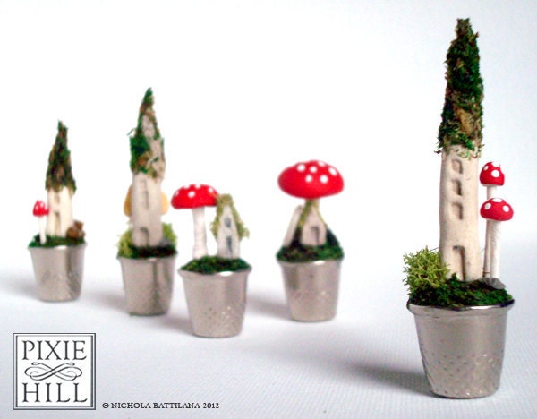 Fairy cottage and toadstool on a mossy thimble lawn - A Faerie Garden