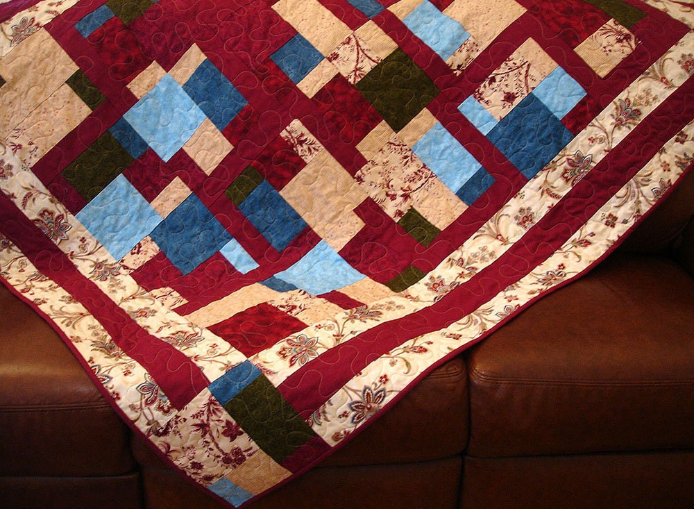 A Patchwork of Garnet Lap Quilt