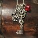 The Skeleton Key Necklace with Crown and Ruby Jewel