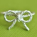 TINY BOW rope ring - sterling silver twisted wire wrap