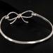 Forget me knot bow sterling silver bangle