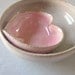 pink pottery heart nested with a miniature rustic white bowl