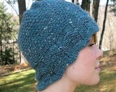 Knitting pattern for Ladies Simply Warm Hat, uses DK or light worsted yarn, model knitted with my handspun tweed heather yarn.