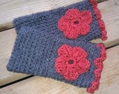 Gray crochetted mittens with burnt orange flower
