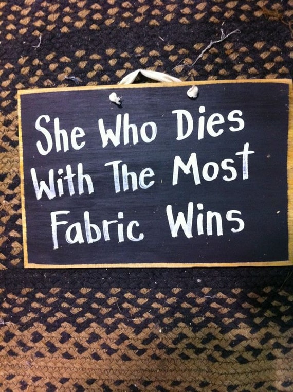 She who dies with the most fabric wins wood sign