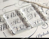Domino Size clear glass tiles. Clear Glass Tiles for Pendants and Magnets. Glamour FX Glass is an Annie Howes Exclusive. 25 Pack.