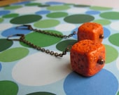 Dangle Orange Earrings. Long dangle orange cube earrings.