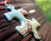 Puzzle piece pendant - red, blue, beige