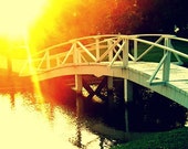 Crossing Over: bold, bright, inspiring fine art photograph print of white bridge over water with yellow and orange sun light and green grass - UninventedColors