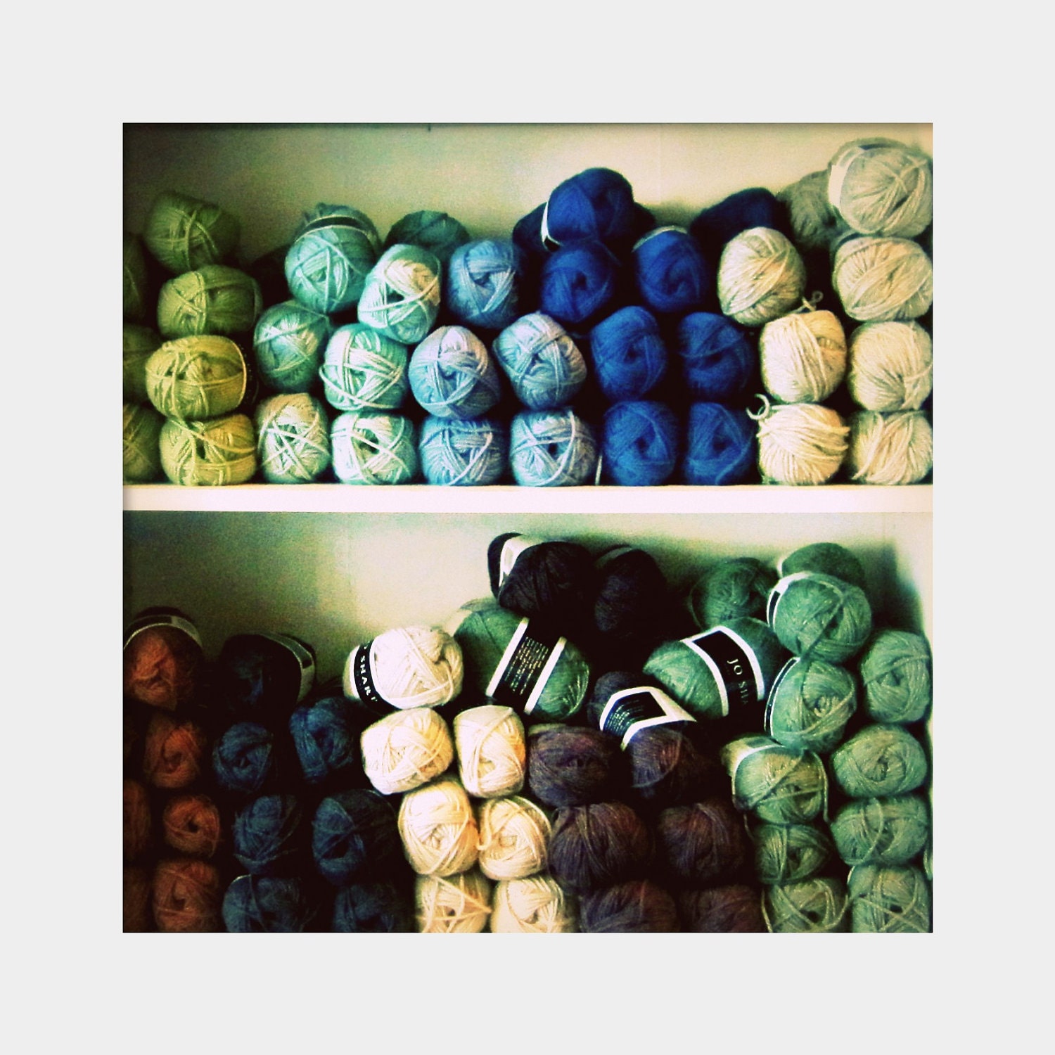 Yarn for a Rainy Day: square still life fine art photograph print of shelves with bolts of yarn in blue, green, gray, navy, periwinkle