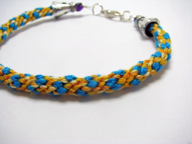 Clearance:  Turquoise and Variegated Yellows in the Kumihimo Style with Lobster Clasp