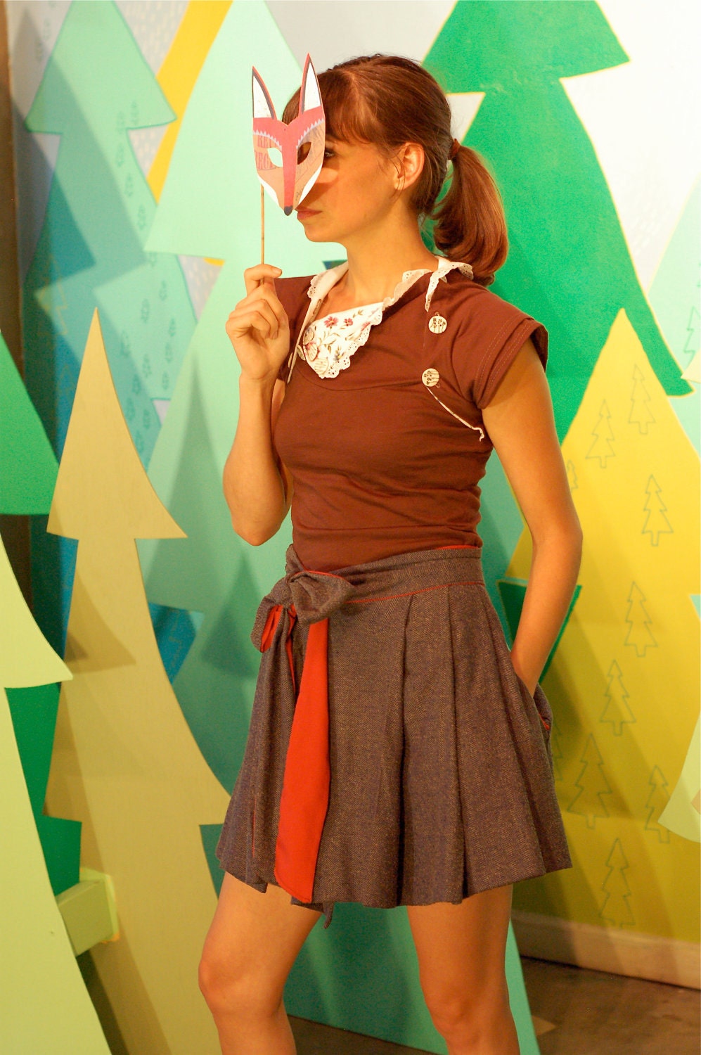herringbone gets a bow --wrap skirt, front pleating, side pockets, red cotton liner, snap closure. bow skirt.