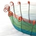 Sixteen sided copper wire basket in teal blue, green, and brown