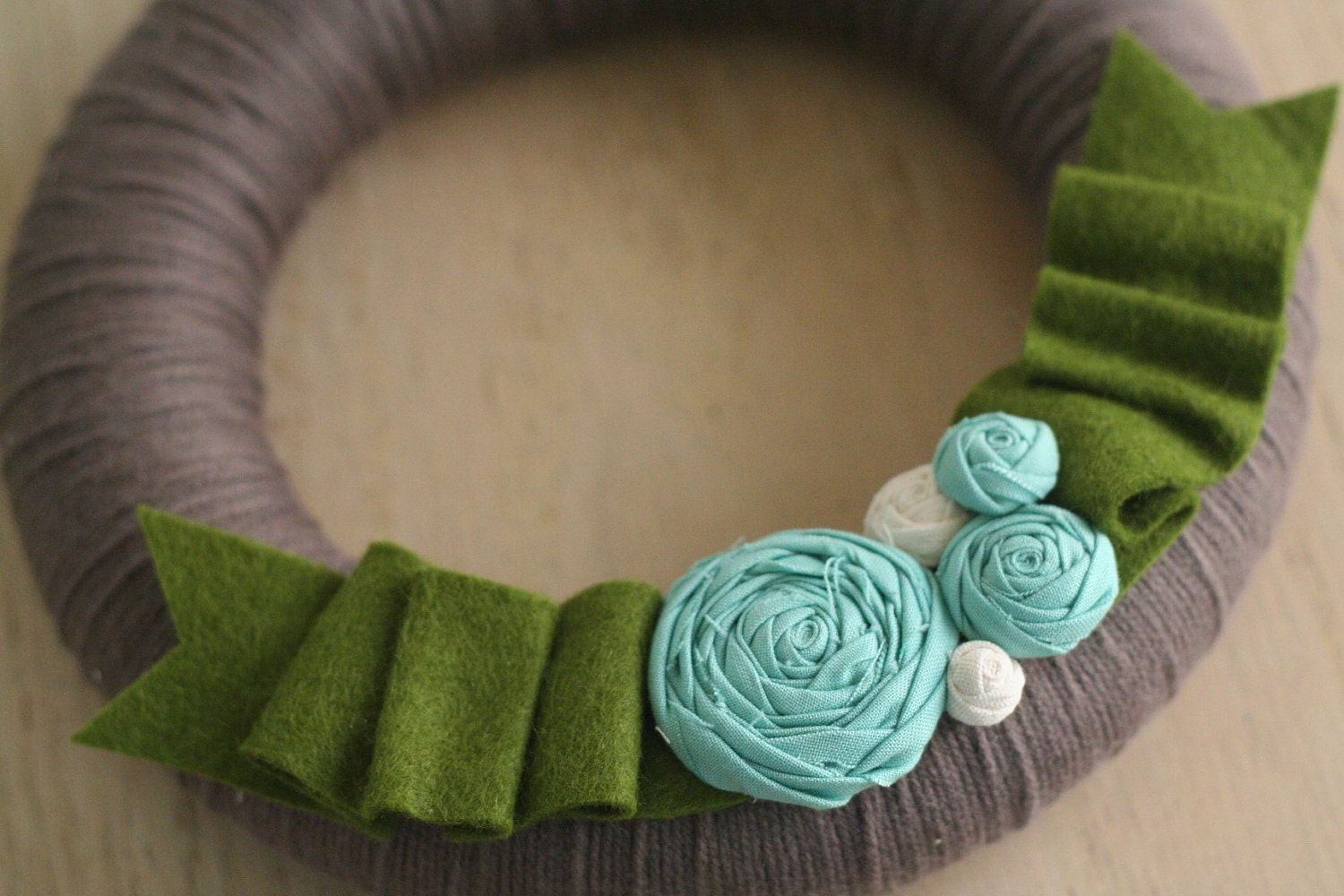 yarn wreath, greenery.