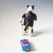 Cat pulling a toy car - hand sculpted ceramic figurine