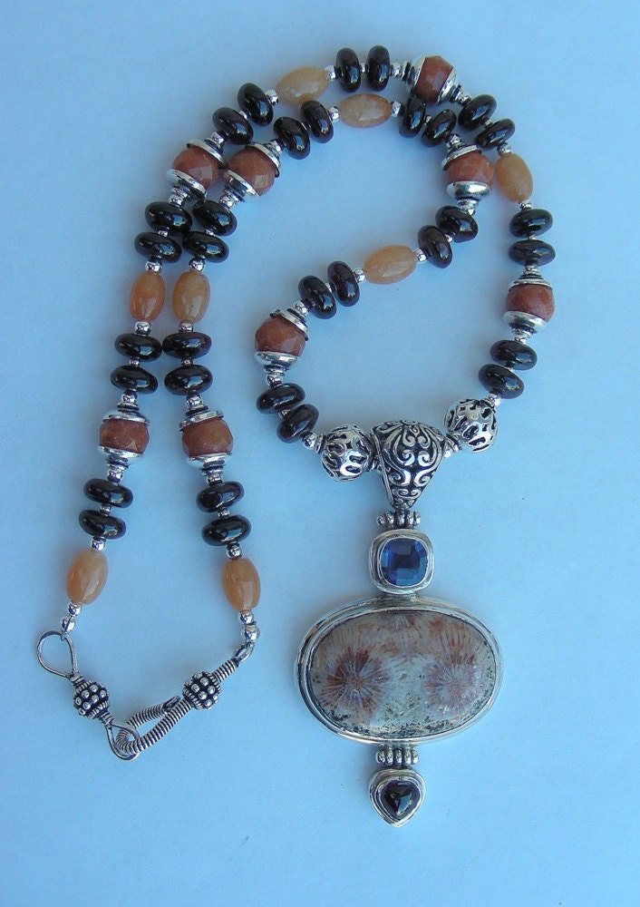 Lolite garnet fossil necklace beautiful pendant all sterling silver comes in a tarnish r pouch