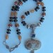 Lolite garnet fossil necklace beautiful pendant all sterling silver comes in a tarnish r pouch