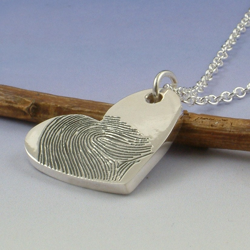 Fingerprint pendant. Your finger print hand engraved onto a sterling silver heart shaped pendant.