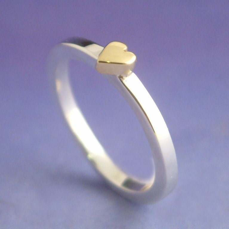 18k yellow gold heart atop a sterling silver ring. Valentine