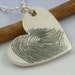 Fingerprint pendant. Your finger print hand engraved onto a sterling silver heart shaped pendant.