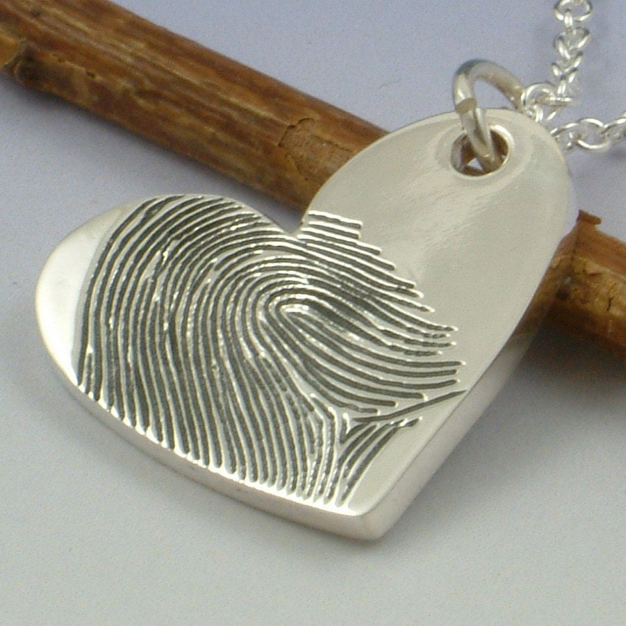 Fingerprint pendant. Your finger print hand engraved onto a sterling silver heart shaped pendant.