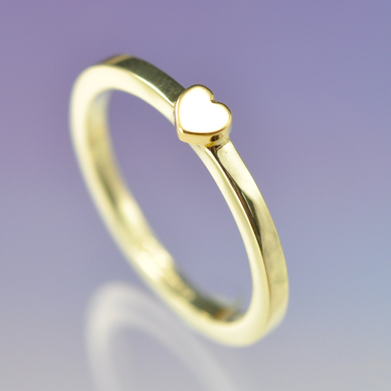 18k yellow gold heart atop a sterling silver ring. Valentine