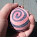 One multi-colored felted pin-cushion, Blue and Hot Pink