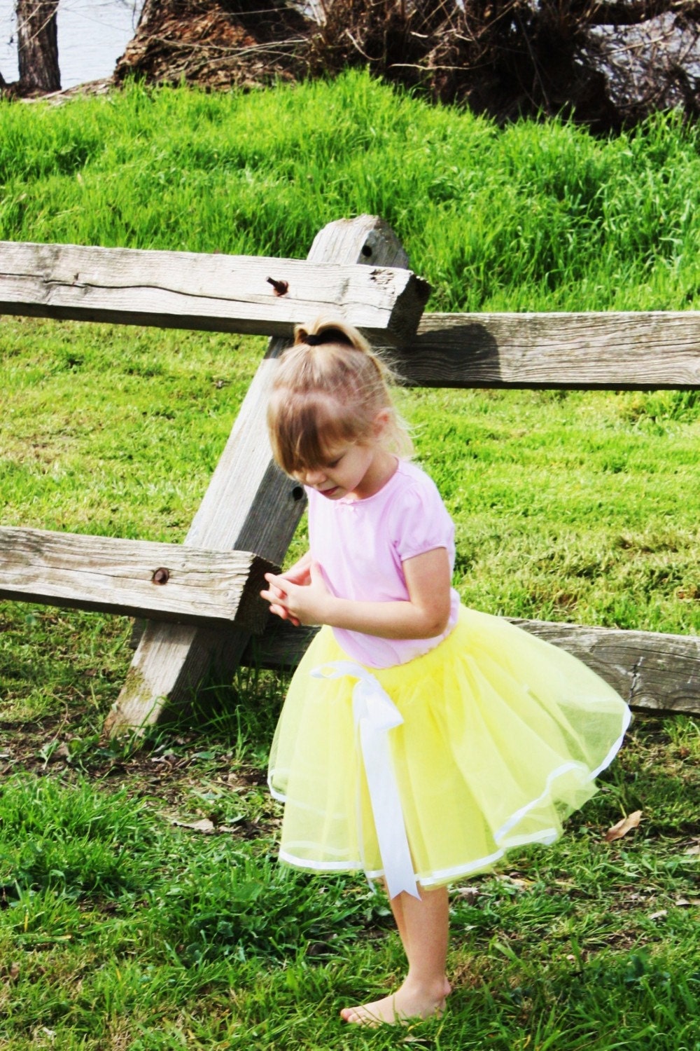Sunshine Ribbon tutu design skirt for girls in butter cream yellow and white.