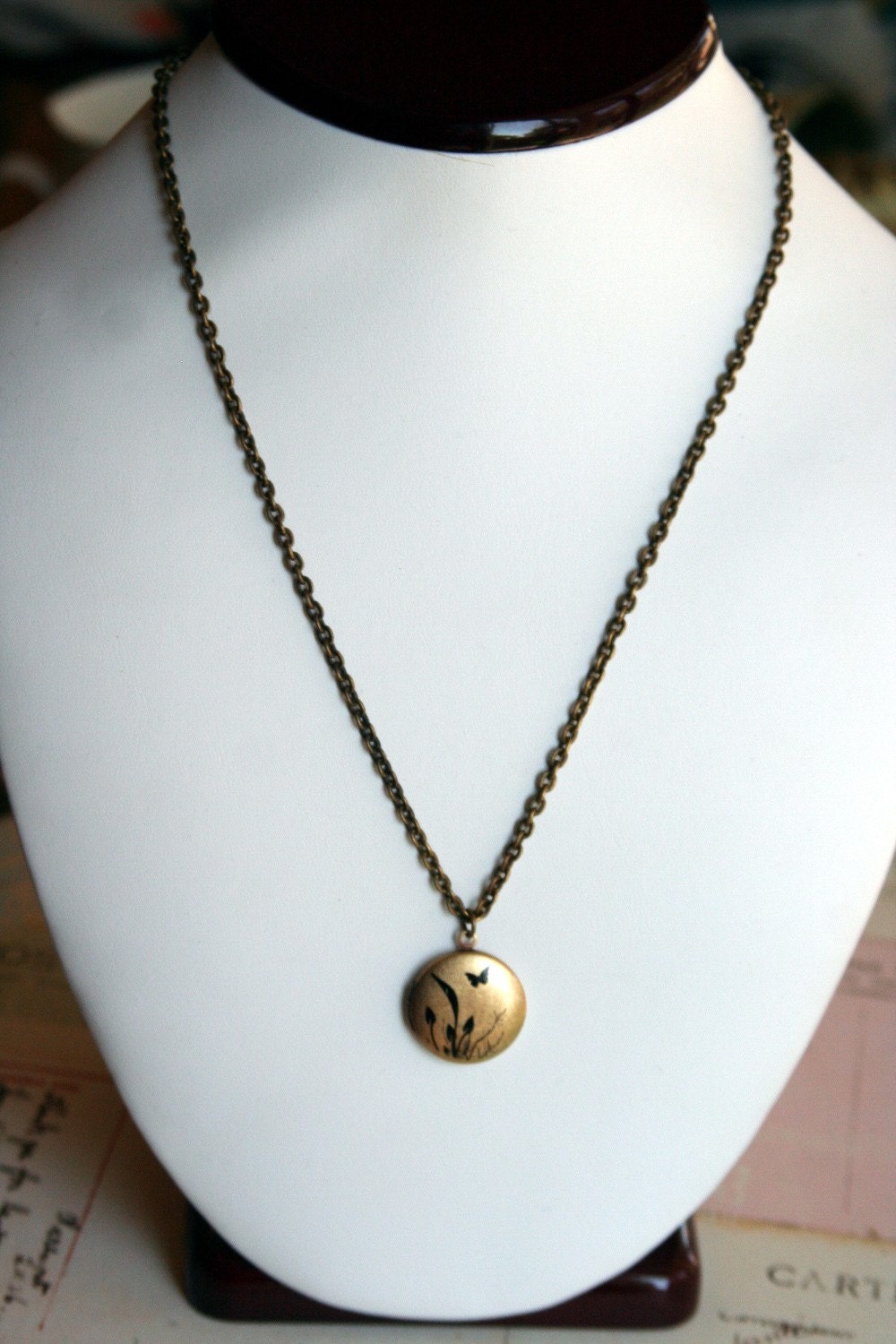 butterfly. locket necklace. brass ox