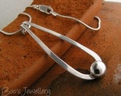 Sterling silver pendant on snake chain with a teardrop loop and pebble of silver